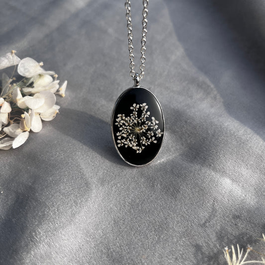 Black Oval Resin Pendant with Real White Flower – Silver Chain Botanical Jewel